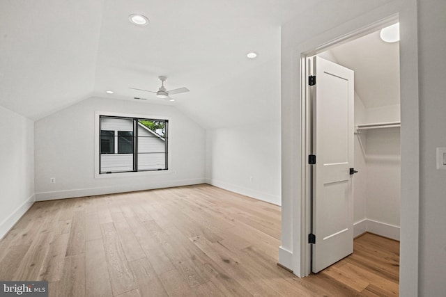 additional living space with ceiling fan, lofted ceiling, and light hardwood / wood-style floors