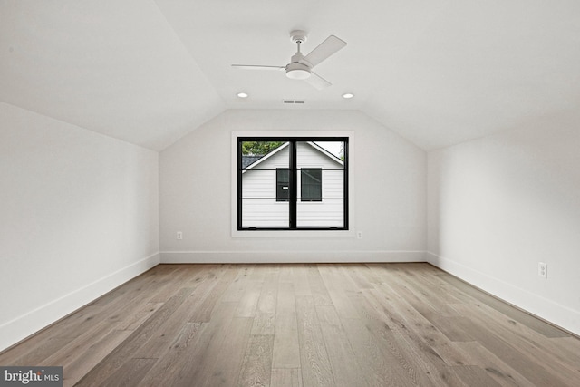 bonus room featuring lofted ceiling, light hardwood / wood-style flooring, and ceiling fan