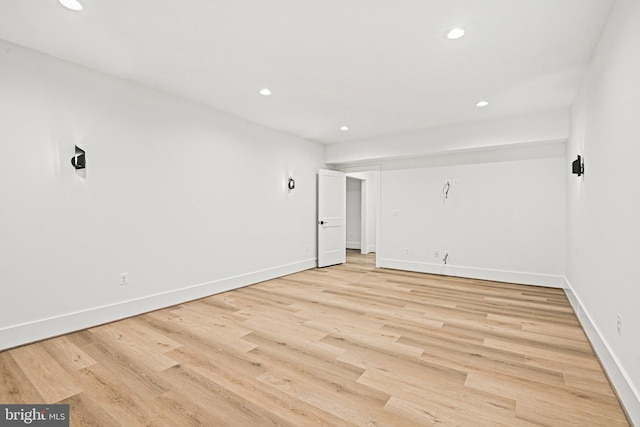 spare room with light wood-type flooring