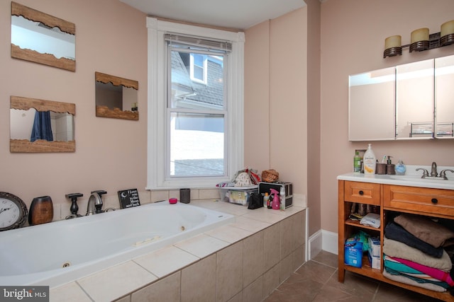 bathroom featuring tile flooring, large vanity, and a relaxing tiled bath