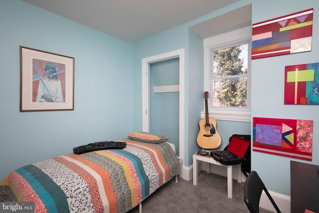 bedroom featuring dark colored carpet