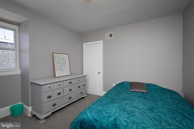 bedroom featuring light carpet