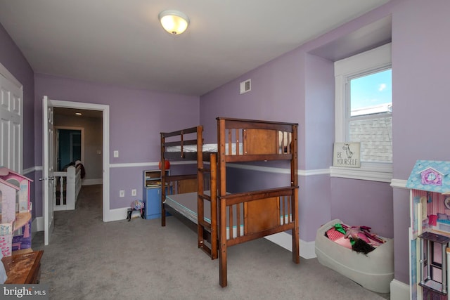 bedroom with light colored carpet