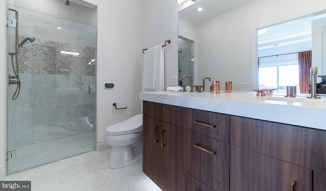 bathroom featuring vanity with extensive cabinet space, a shower with shower door, tile floors, and toilet