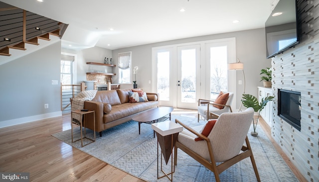 living room featuring light hardwood / wood-style flooring and a fireplace