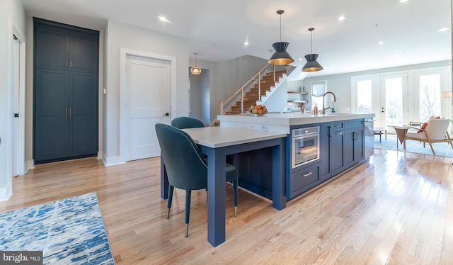 dining area featuring light hardwood / wood-style floors and sink