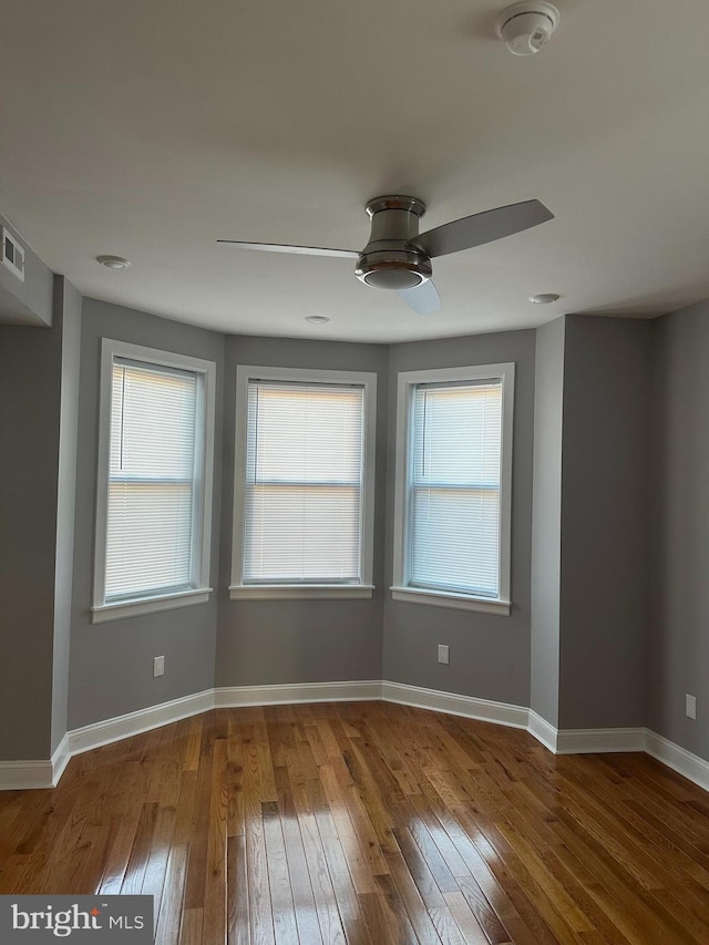 spare room featuring ceiling fan and wood-type flooring