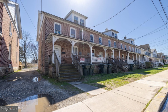 townhome / multi-family property with covered porch