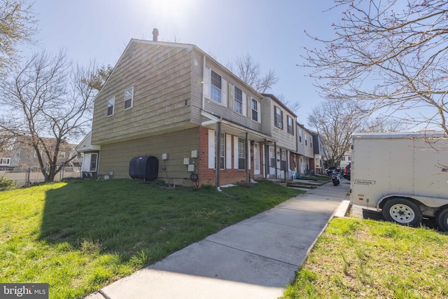 view of property exterior with a lawn