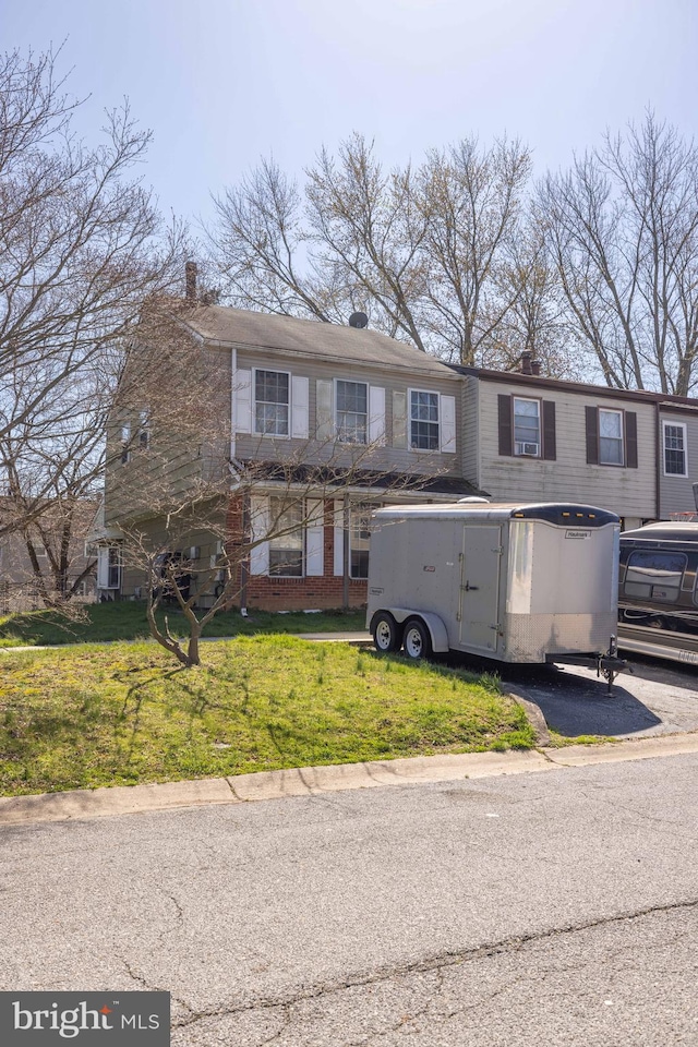 view of front of house featuring a front lawn