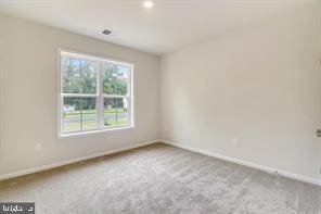 unfurnished room with carpet floors