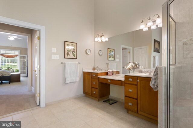 bathroom with vanity, a towering ceiling, an enclosed shower, and tile patterned floors