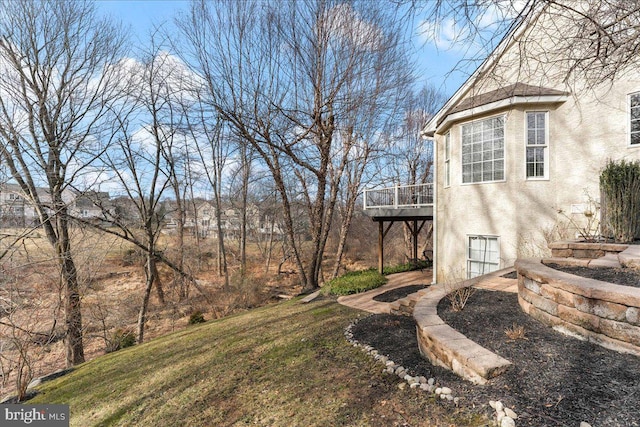 view of yard featuring a wooden deck