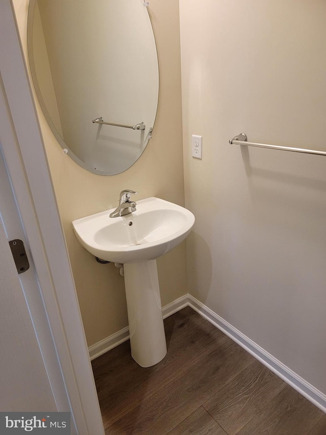 bathroom with wood-type flooring