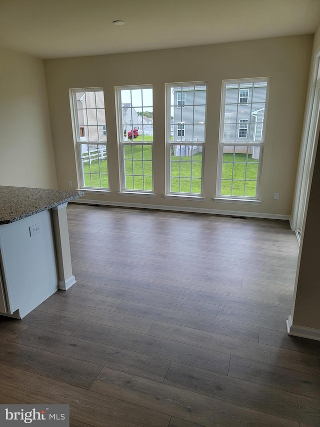 interior space with dark hardwood / wood-style flooring