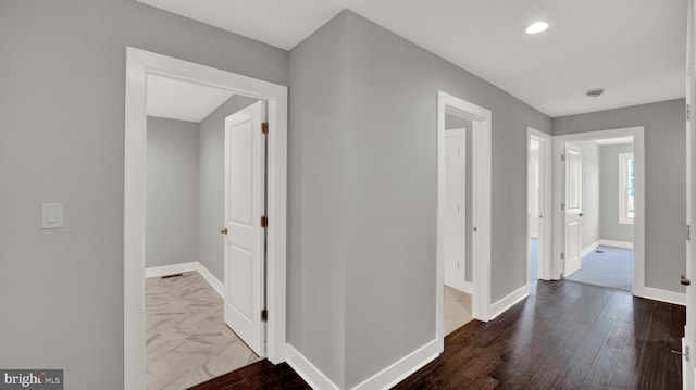 hallway featuring dark hardwood / wood-style floors