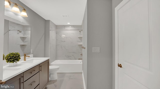 full bathroom with double sink vanity, toilet, tiled shower / bath, and tile flooring