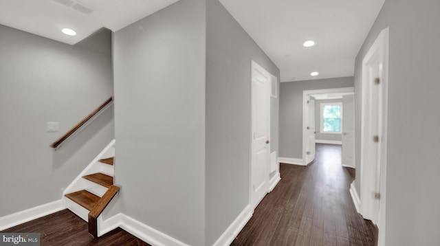 hallway with dark wood-type flooring