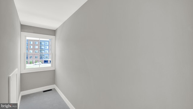 corridor with carpet flooring