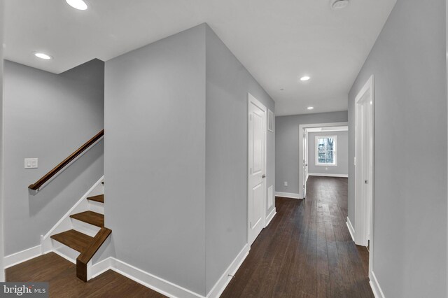 hallway featuring dark wood-type flooring