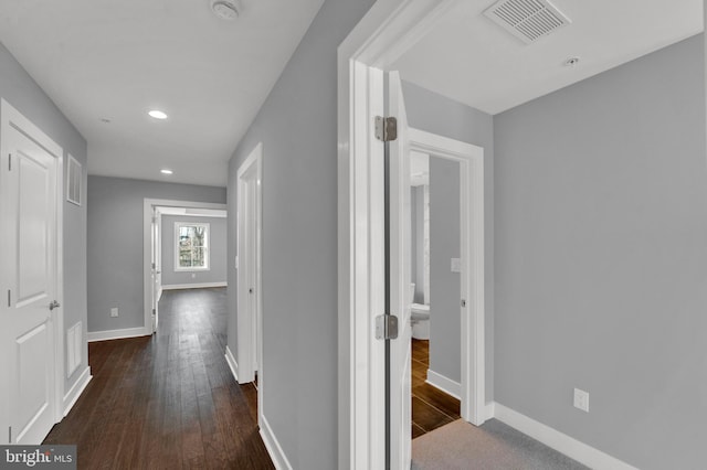 hall with dark wood-type flooring