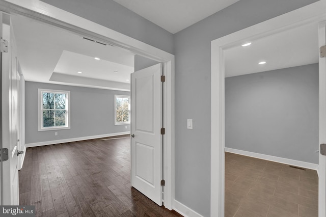 interior space with dark tile flooring