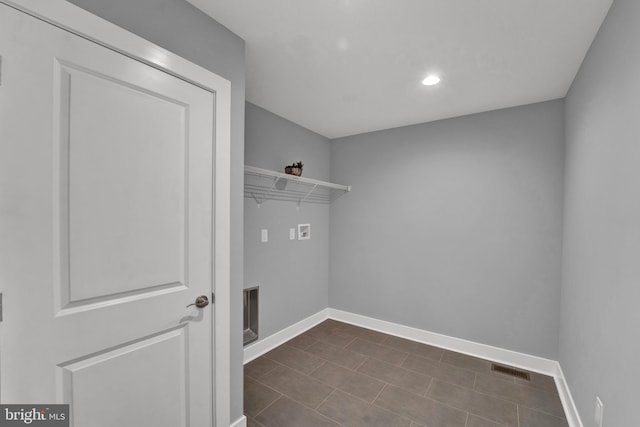 interior space featuring dark tile floors