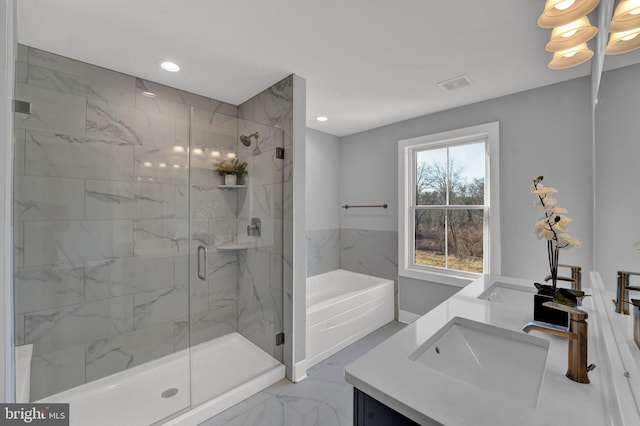 bathroom with separate shower and tub, tile floors, and dual bowl vanity