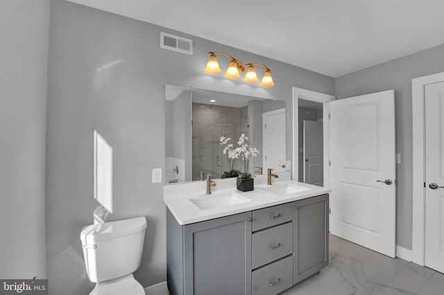 bathroom with toilet, double vanity, and tile flooring