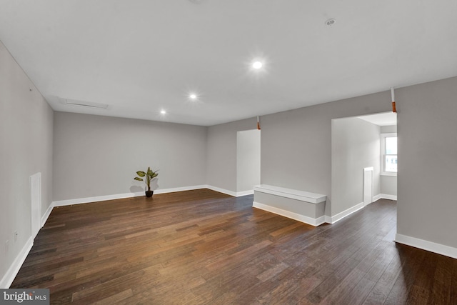spare room with dark hardwood / wood-style floors