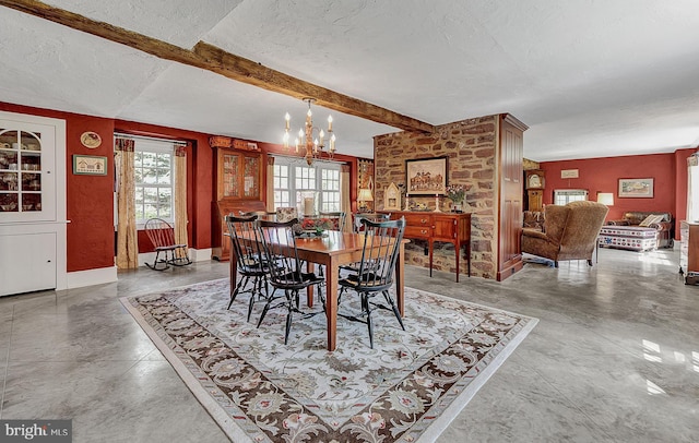 dining room with a notable chandelier, beamed ceiling, and a textured ceiling