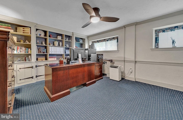 home office featuring ornamental molding, ceiling fan, and dark colored carpet