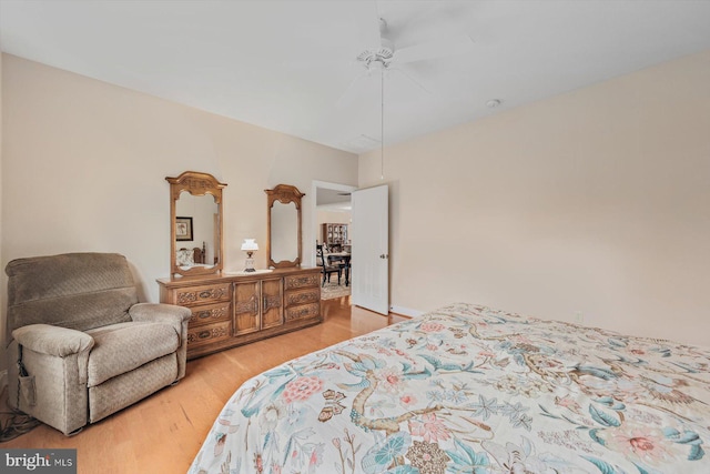 bedroom featuring ceiling fan and light hardwood / wood-style flooring