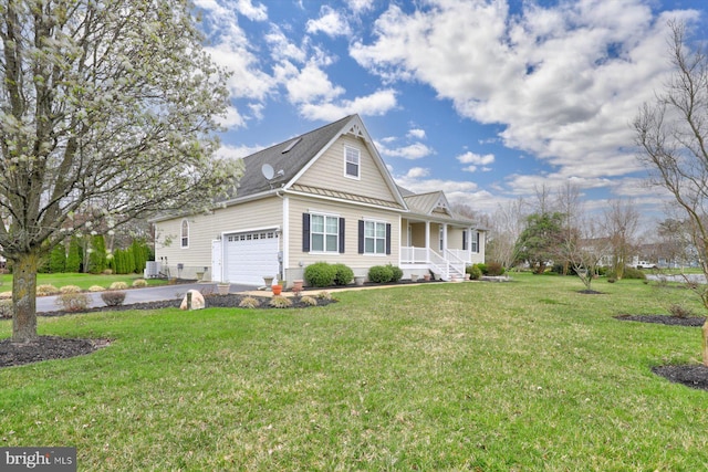 view of front of property featuring a front lawn, covered porch, and a garage