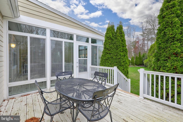 wooden terrace featuring a sunroom