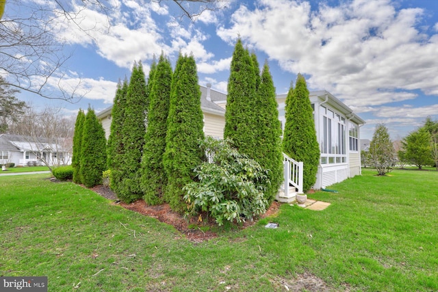 view of property exterior featuring a yard