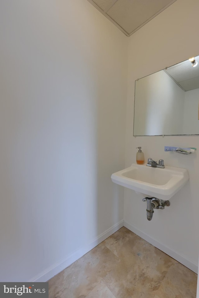 bathroom featuring tile flooring and sink