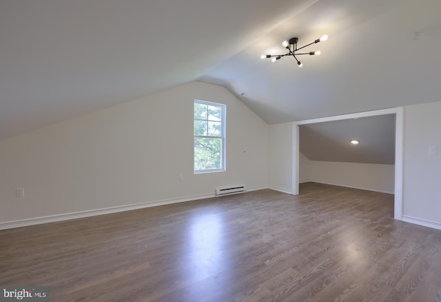 bonus room with lofted ceiling, a notable chandelier, dark wood-type flooring, and a baseboard heating unit