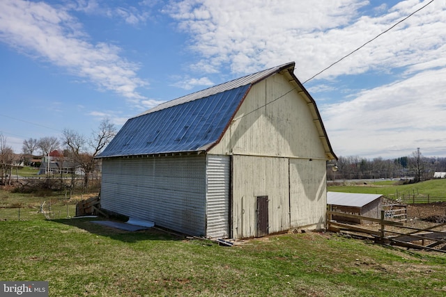 view of outdoor structure with a lawn