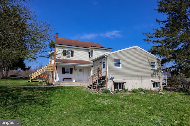 back of house featuring a yard