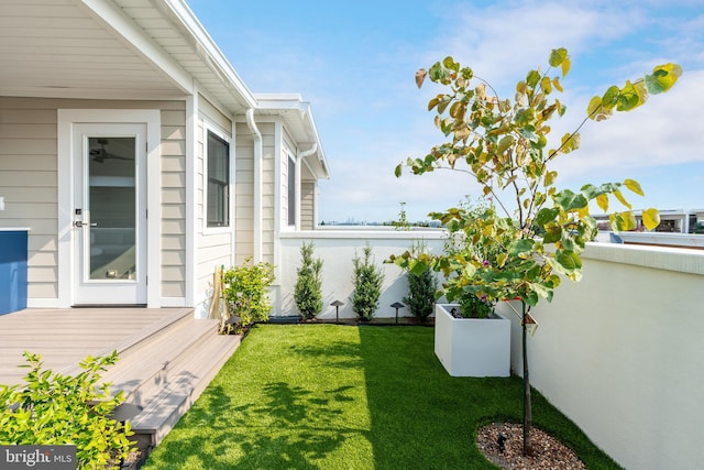 view of yard featuring a wooden deck