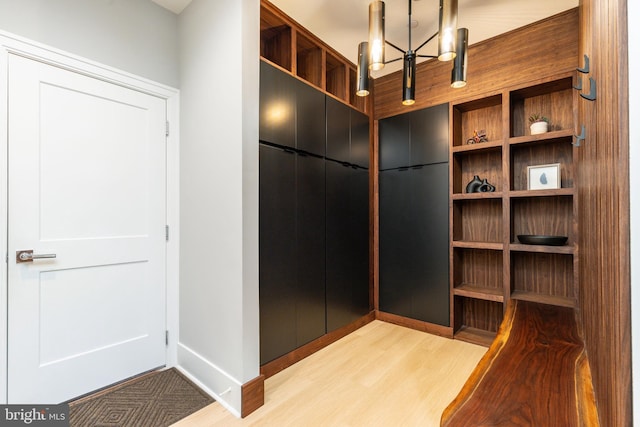 walk in closet featuring light hardwood / wood-style flooring