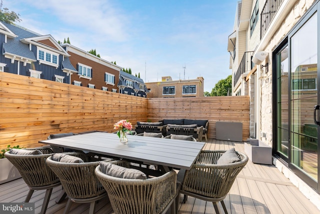 deck with an outdoor hangout area and outdoor dining area