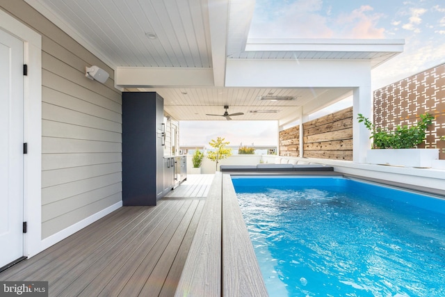 view of swimming pool with ceiling fan