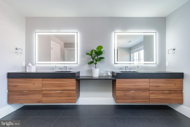 bathroom with tile patterned flooring and vanity