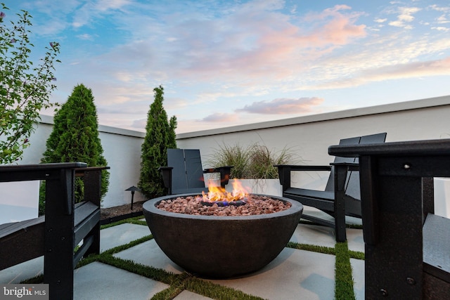 patio terrace at dusk with a fire pit