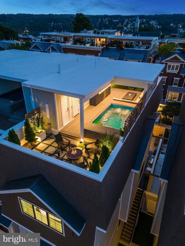 view of swimming pool with a fire pit