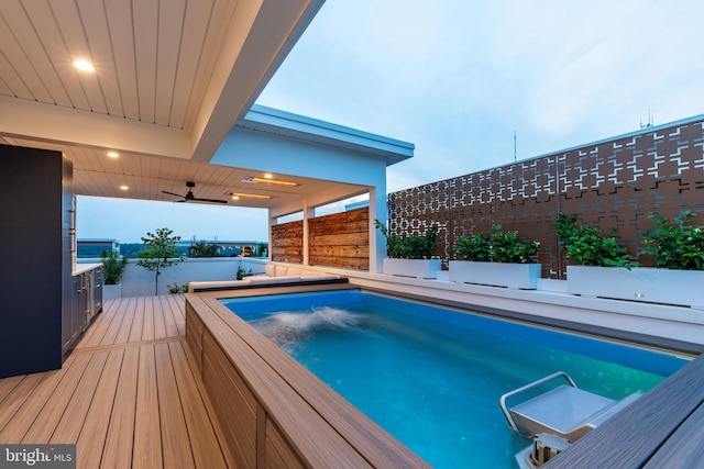 view of pool with ceiling fan