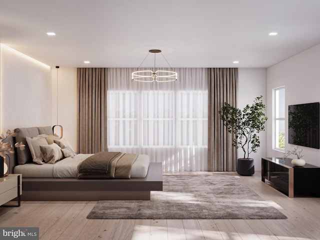 bedroom featuring an inviting chandelier, recessed lighting, and wood finished floors