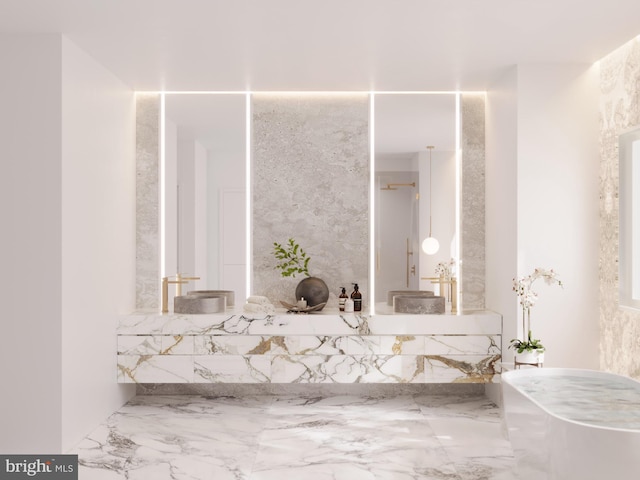 full bath with marble finish floor, a bath, and vanity